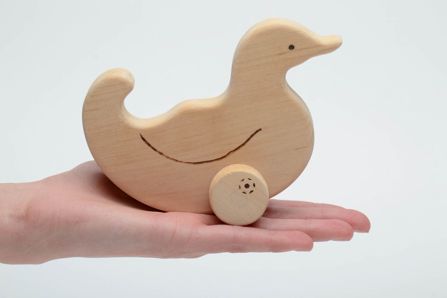 Wooden wheeled toy Duck photo 5