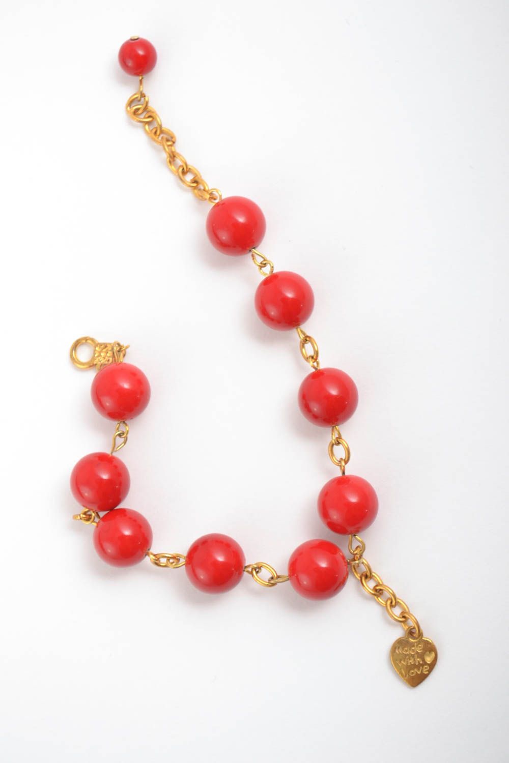 Red large beads bracelet on a chain in gold color with heart shape charm photo 2