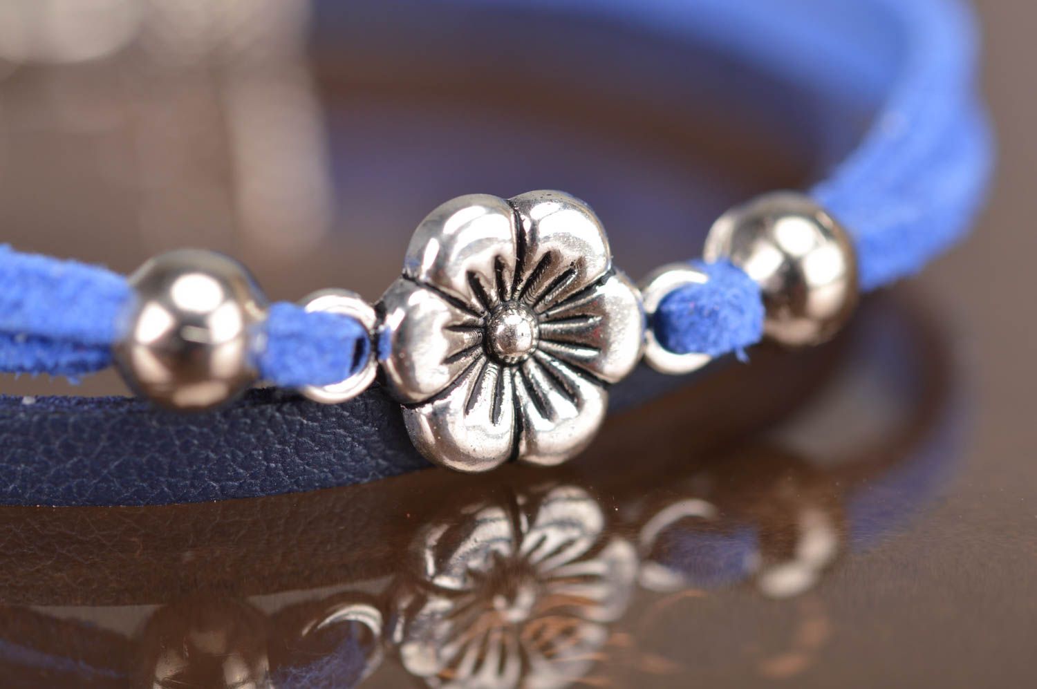 Handmade thin blue genuine leather cord wrist bracelet with metal flower element photo 5