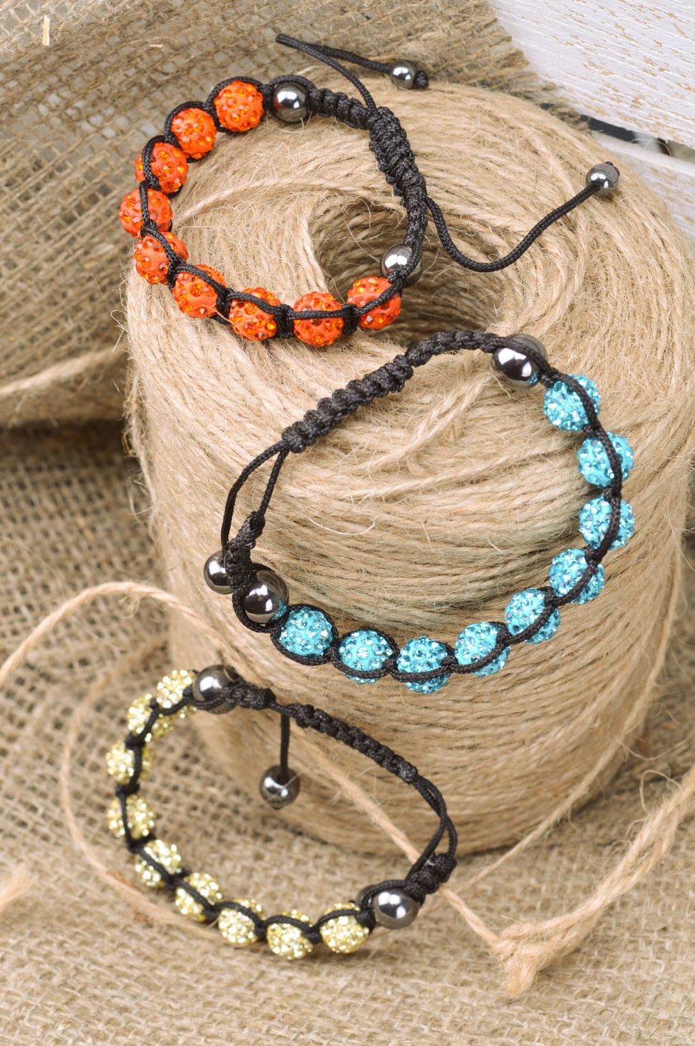 Set of beautiful designer handmade women's wrist bracelets woven of threads and beads 3 items photo 1