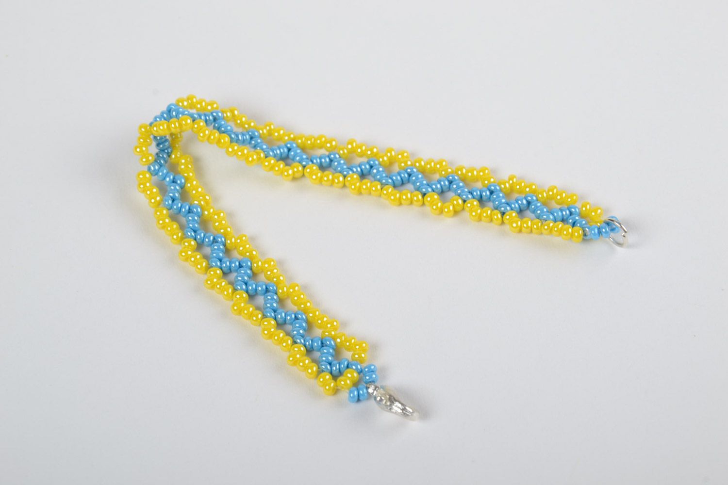 Beautiful bright handmade volume woven bead bracelet of yellow and blue colors photo 4