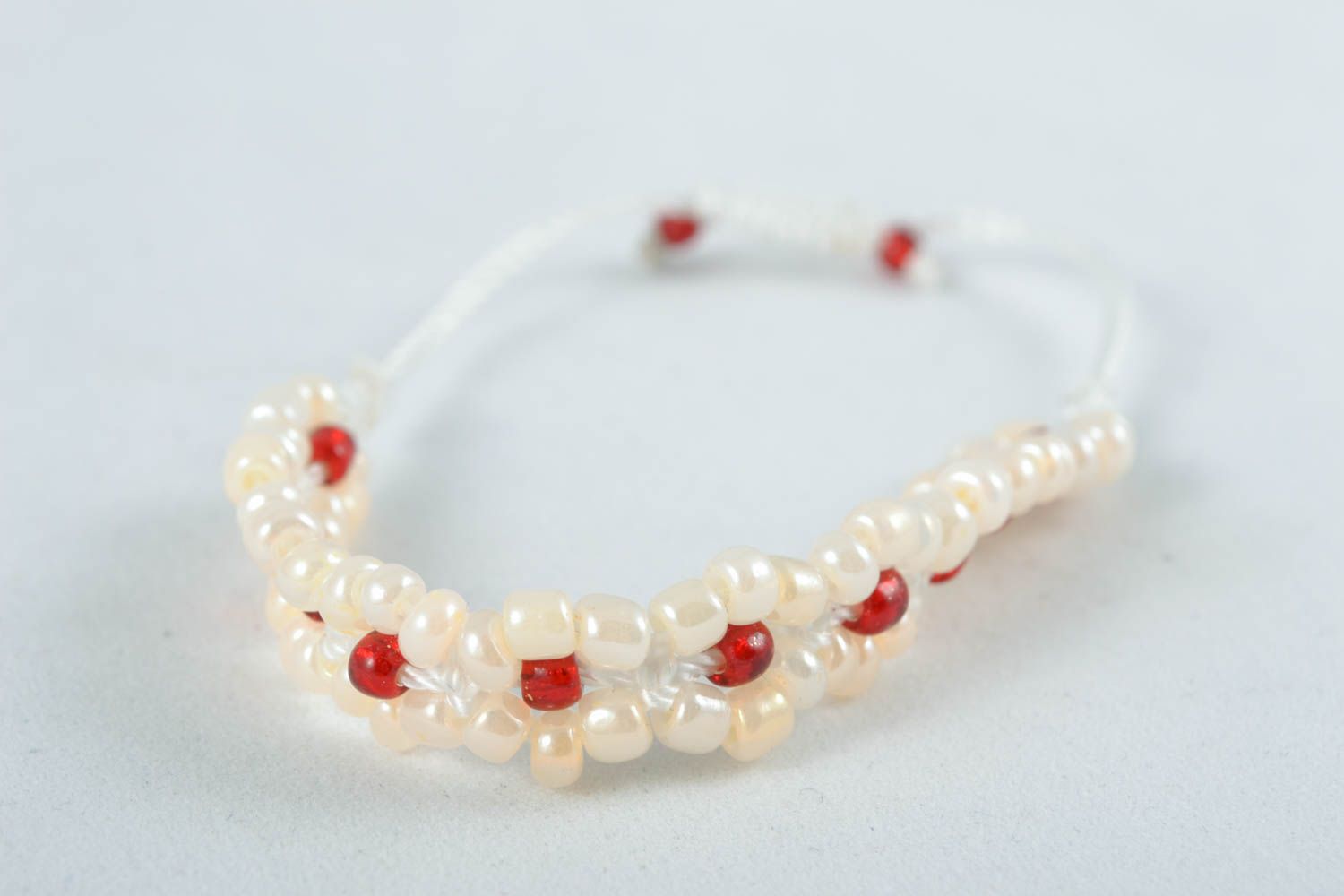 Tender white and red beads strand bracelet fon white cord for girl photo 1