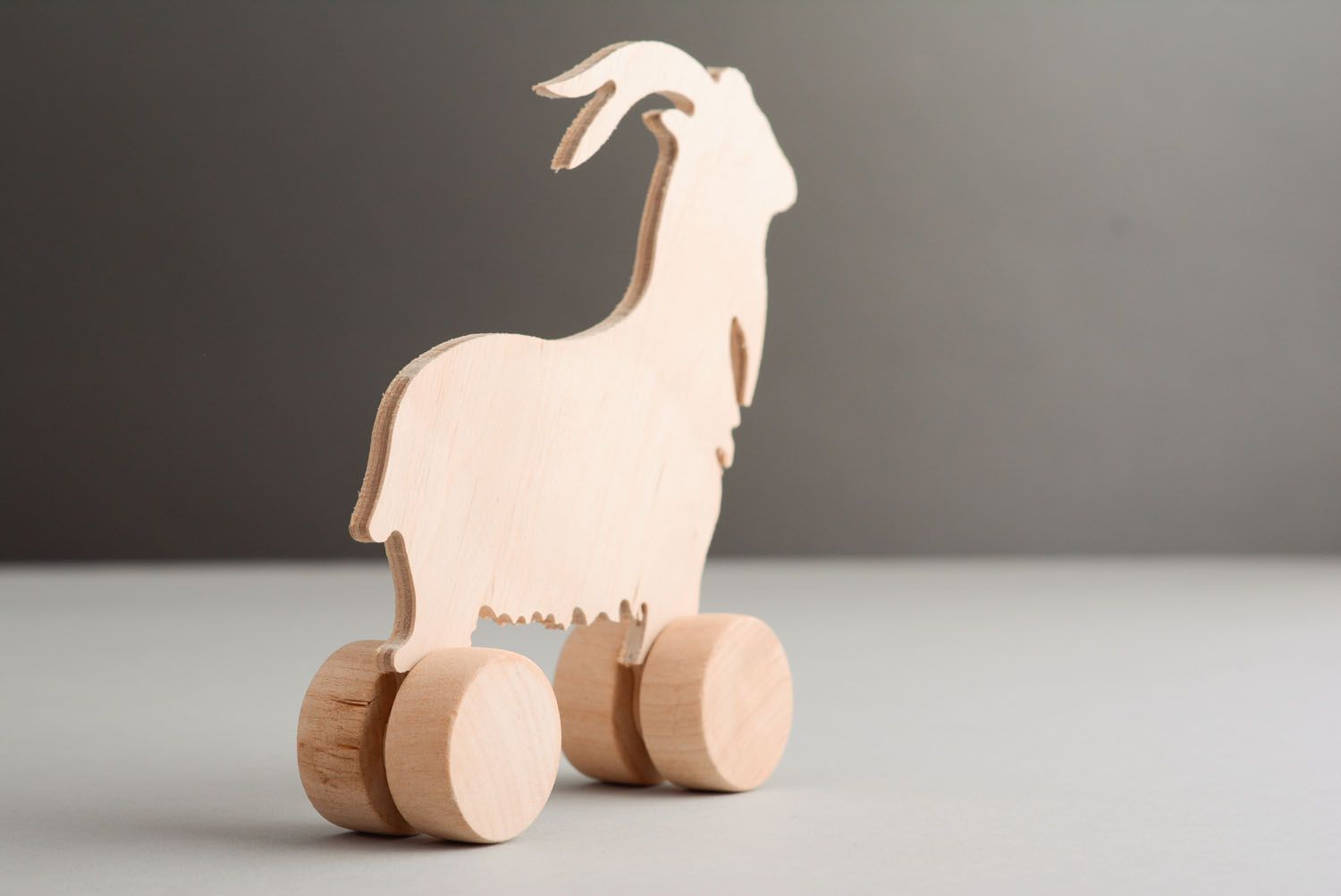 Wooden toy with wheels Goat photo 4