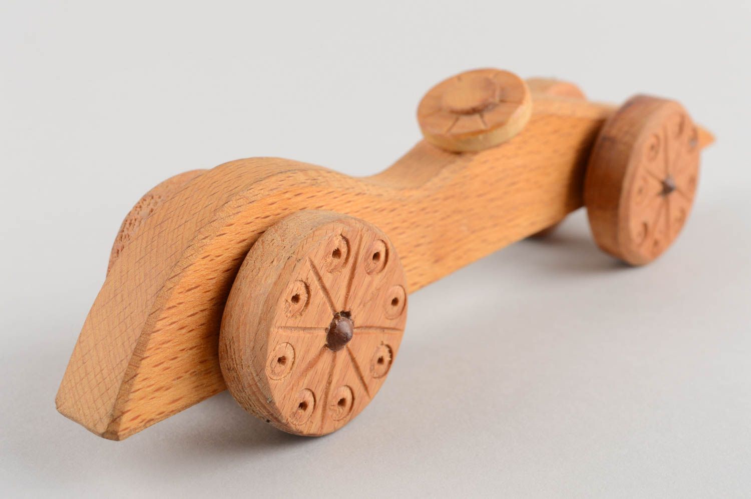Handmade designer carved wooden wheeled toy car for children eco photo 4