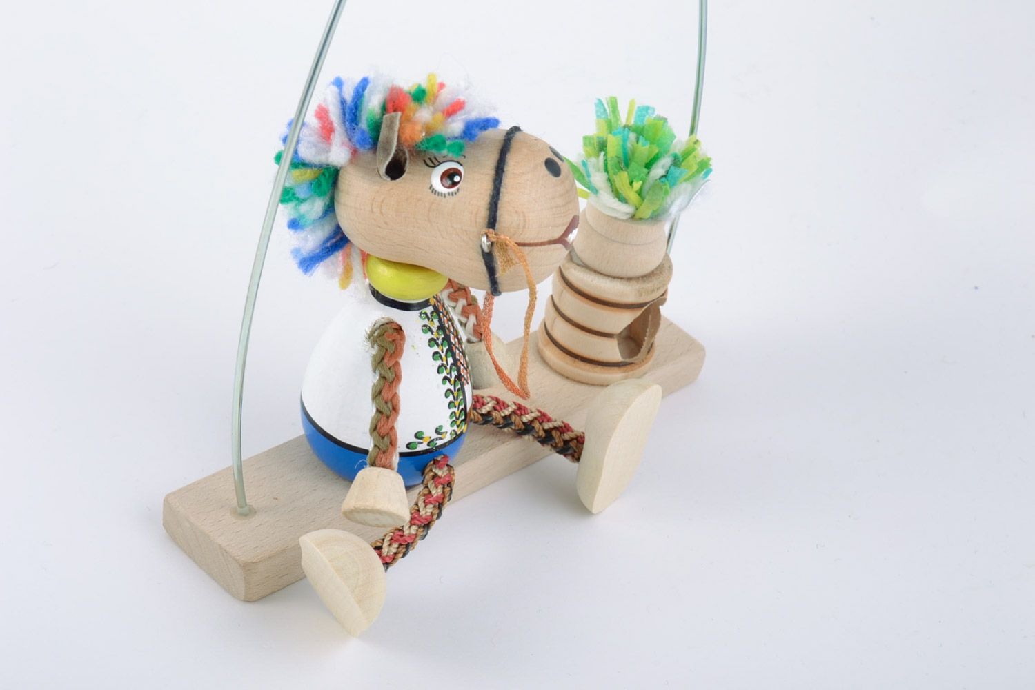 Handmade eco friendly painted wooden toy for kids and interior horse on swing photo 4