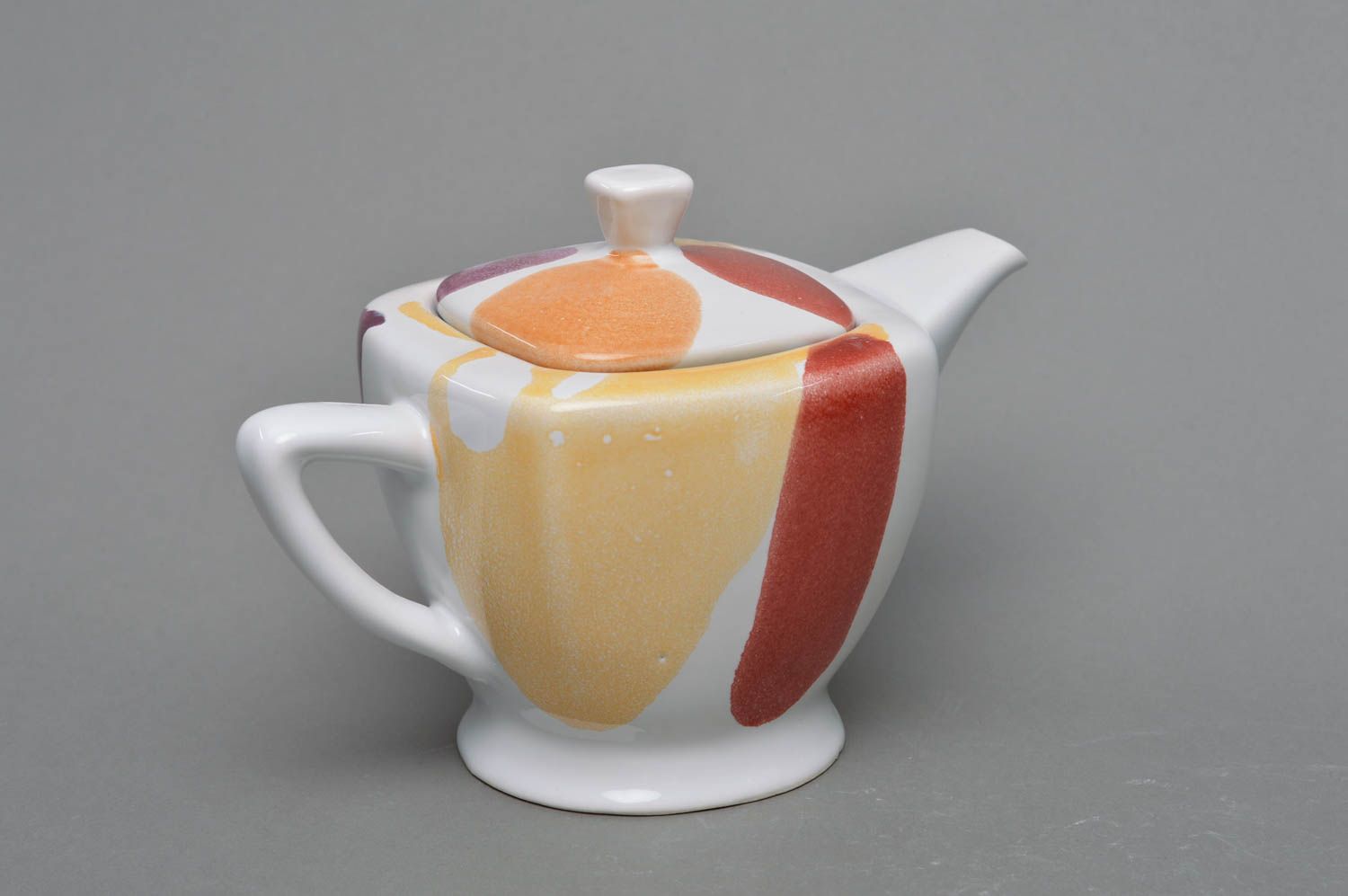 Square porcelain white tea kettle in red, yellow, and white color  photo 1