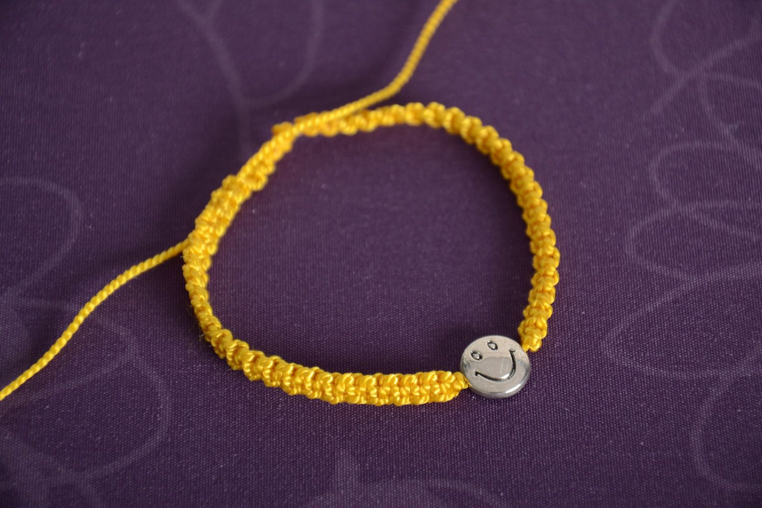 Handmade macrame woven women's wrist bracelet with metal charm smilie photo 1