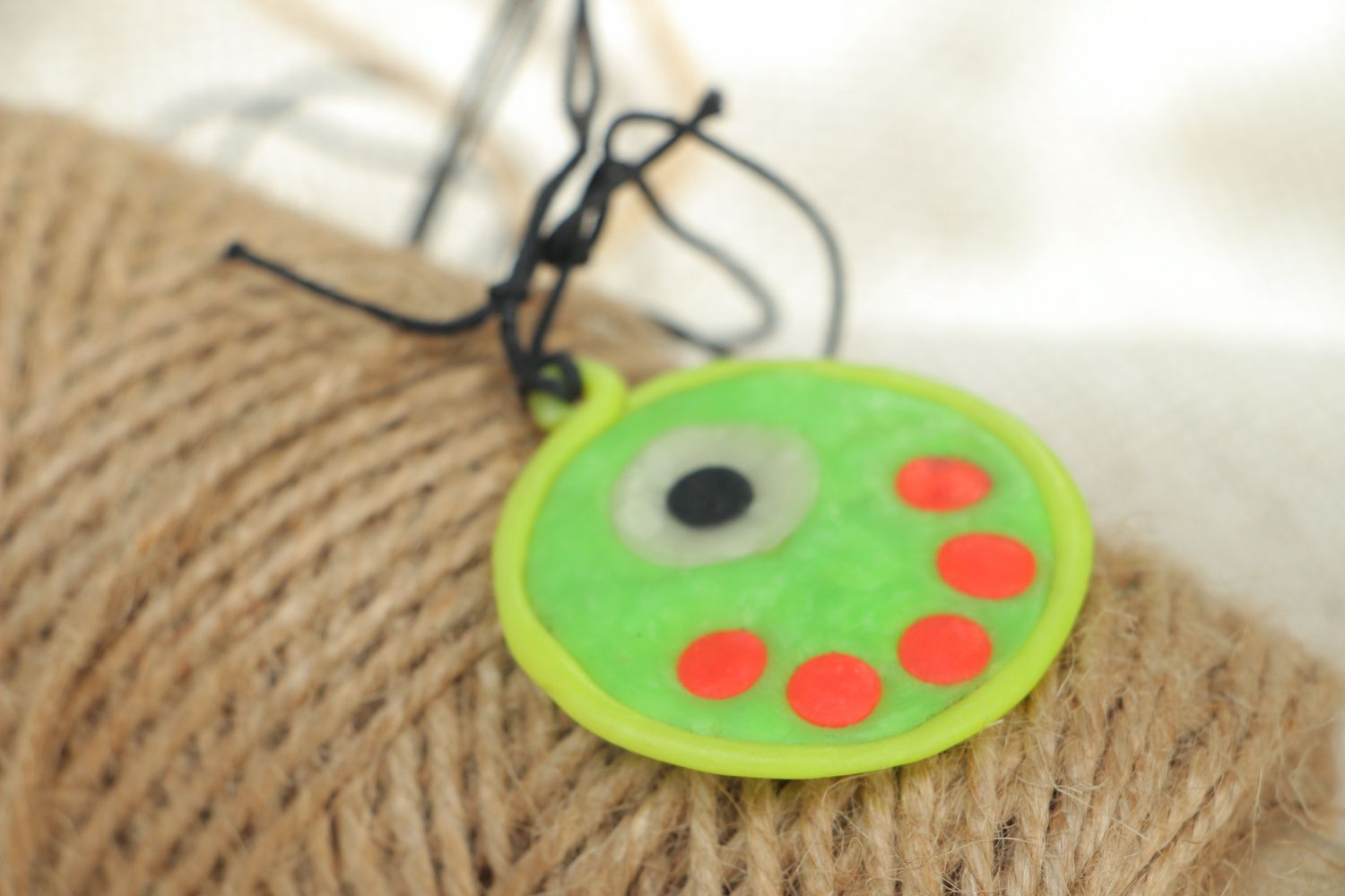 Round polymer clay pendant that glows in darkness photo 4
