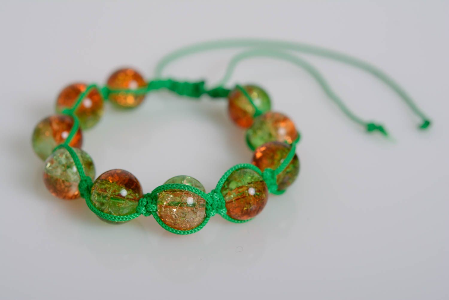 Handmade bracelet made of plastic beads on waxed cord braided green accessory photo 1