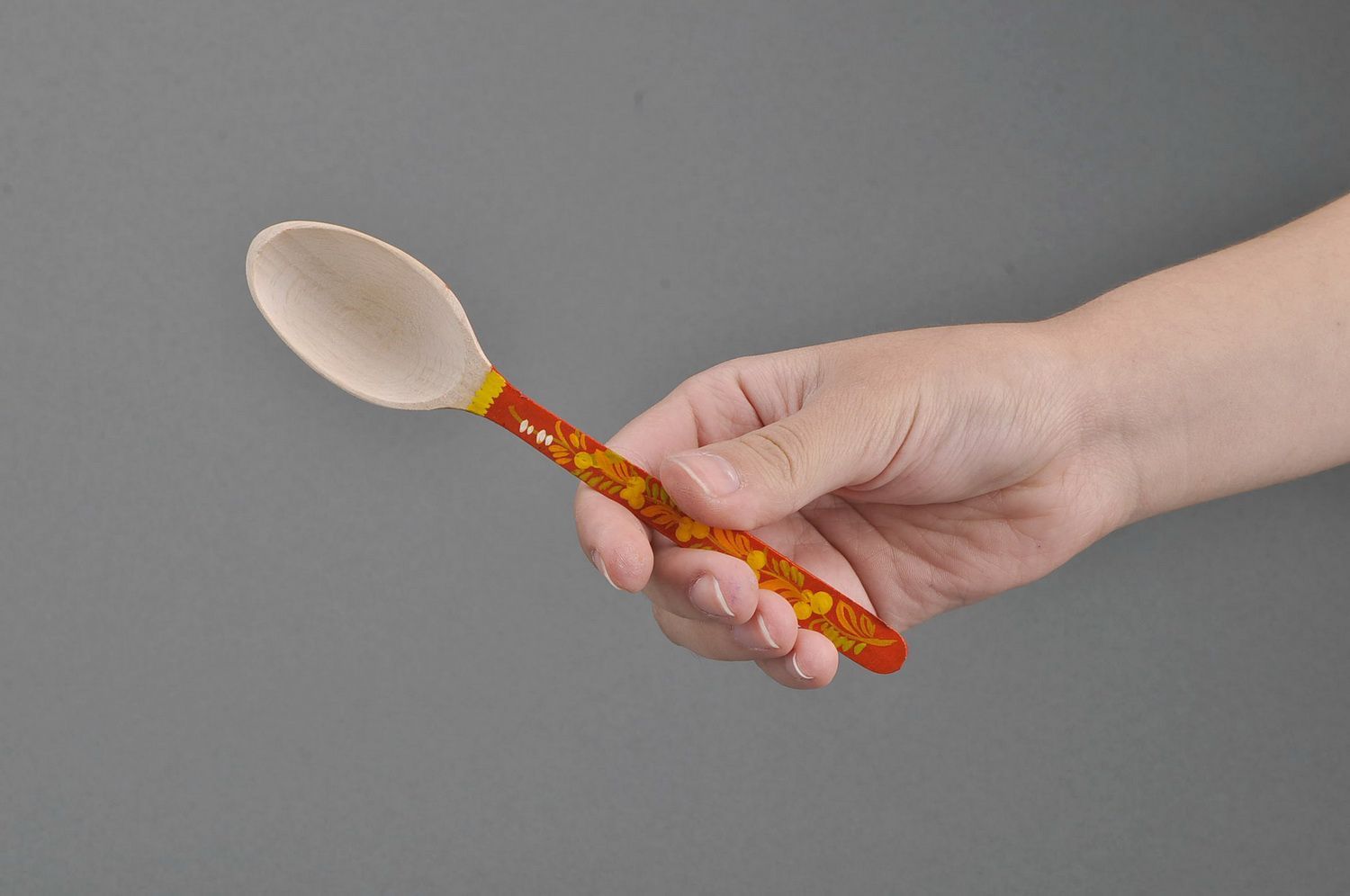 Wooden teaspoon with orange handle photo 2