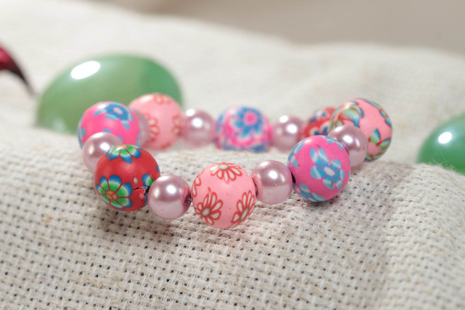 Pink handmade designer children's polymer clay bead bracelet with flower pattern photo 1
