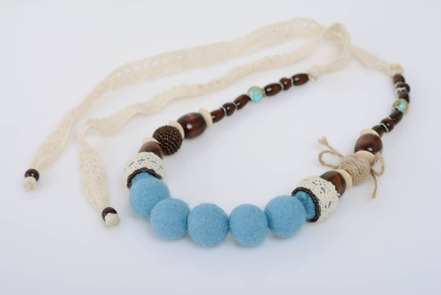 Handmade blue felted wool bead necklace with wooden beads and light lace photo 1