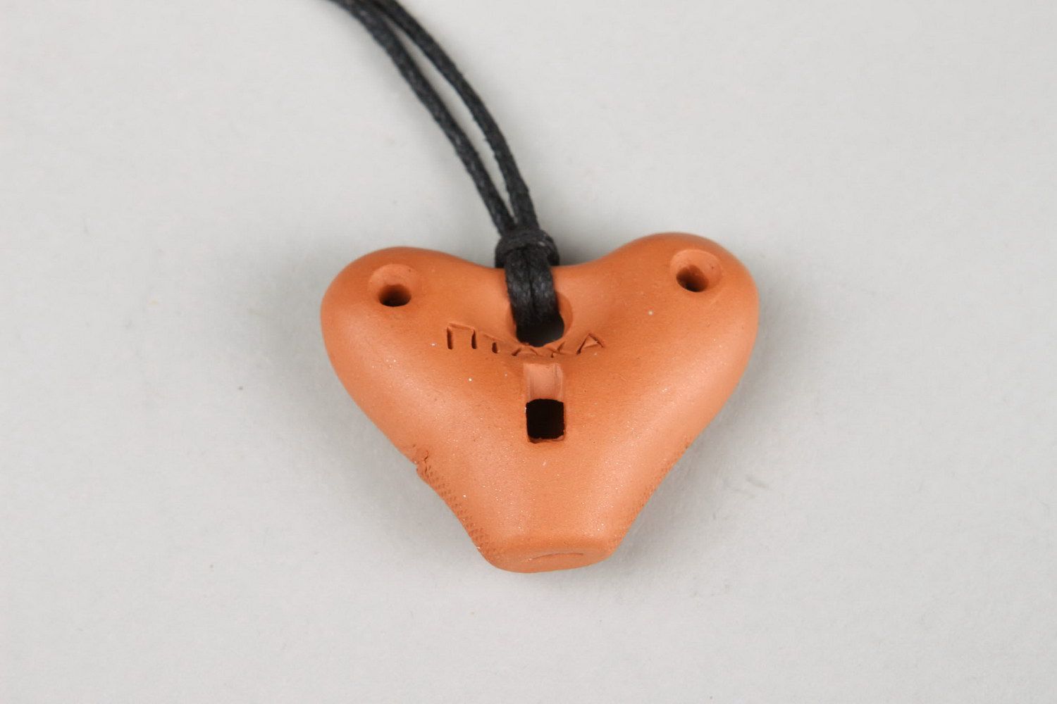 Heart-shaped tin whistle pendant made of clay photo 3