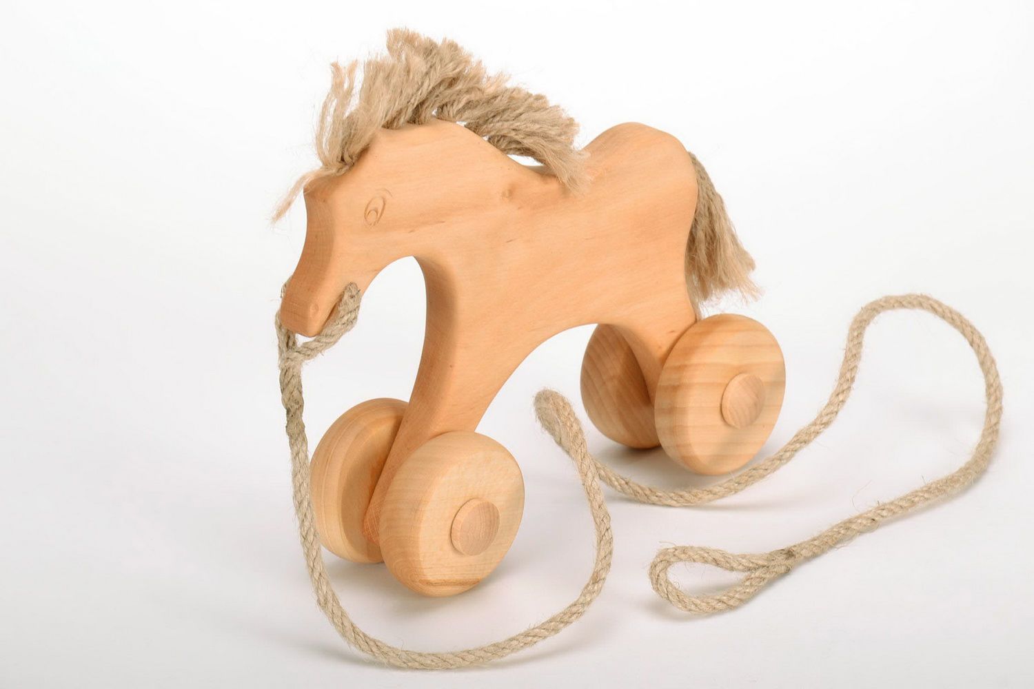 Holzspielzeug Pferd mit Rädern foto 3