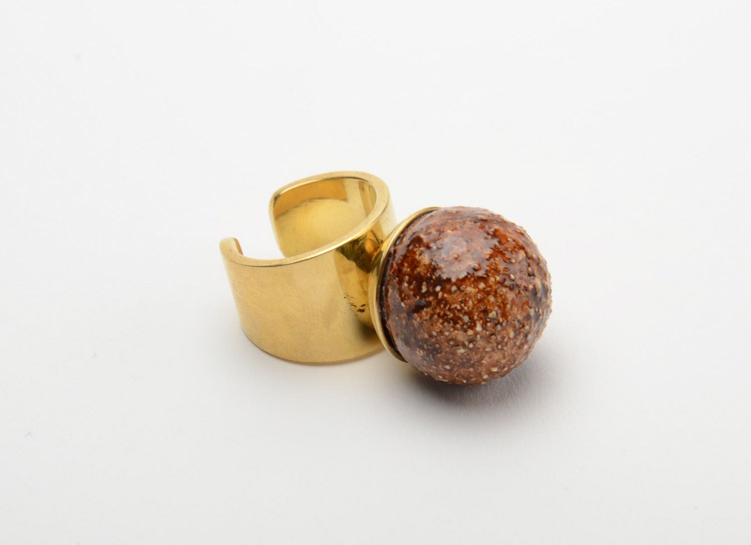 Brown handmade ceramic ring with golden-like brass basis photo 2