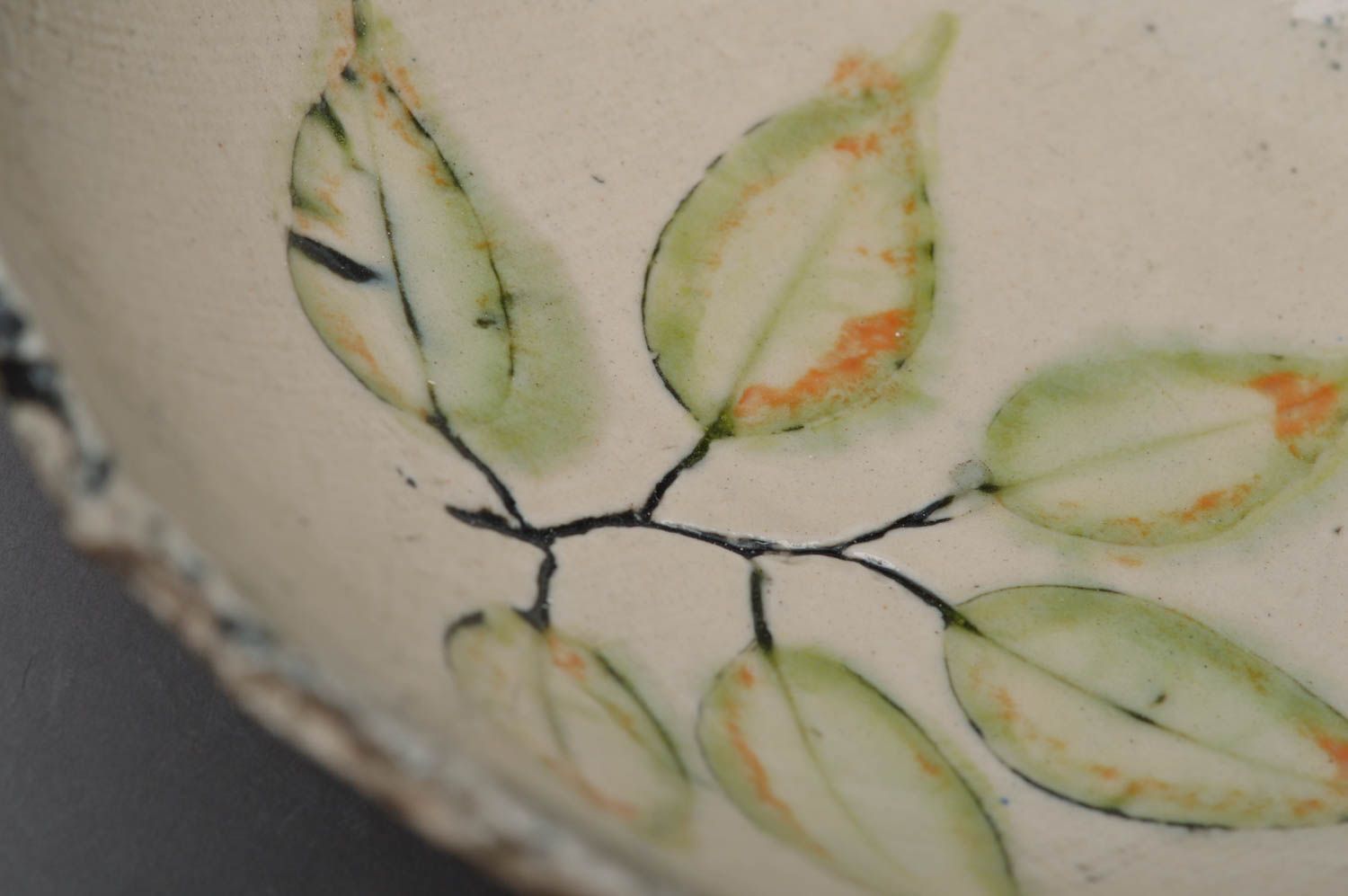 Handmade small designer porcelain bowl painted with glaze with leaves image photo 2
