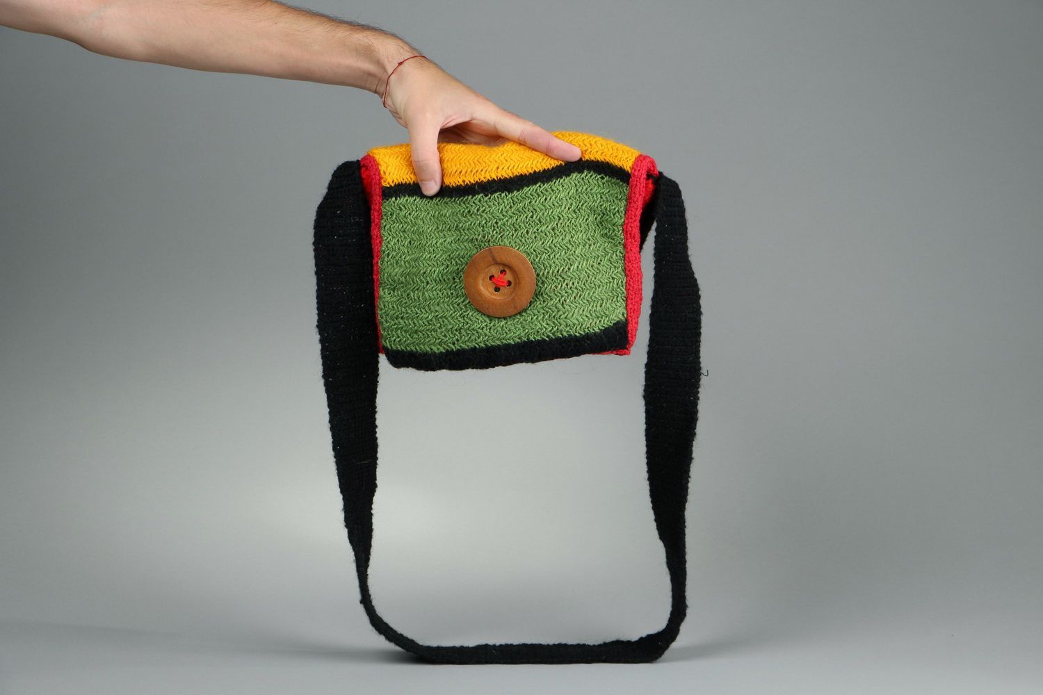 Wool knitted purse with button photo 1