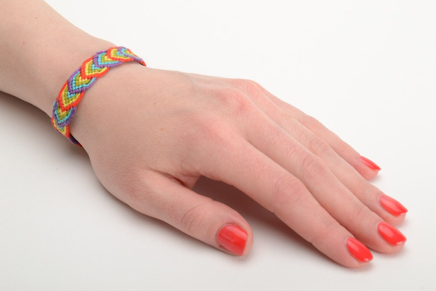 Handmade thin friendship wrist bracelet woven of colorful embroidery floss photo 5