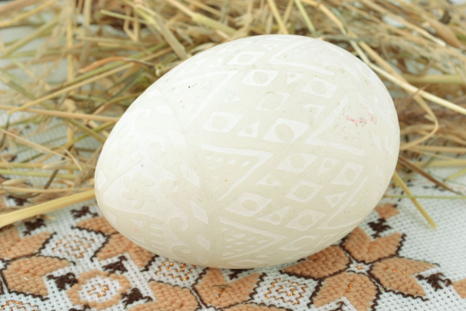 Handmade tender white Easter egg decorated using acid etching technique  photo 1