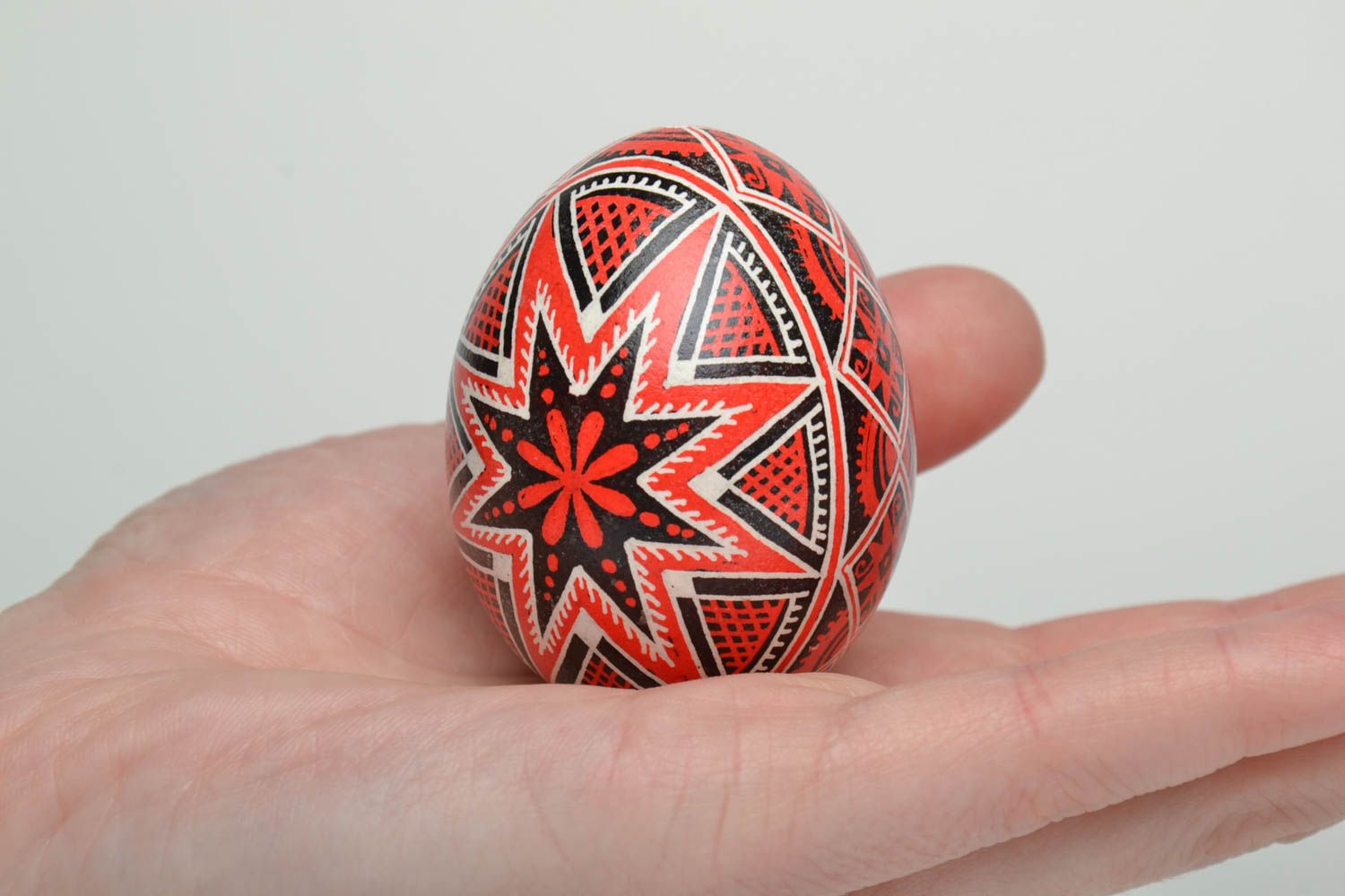 Handmade Easter egg painted with red and black colors photo 5