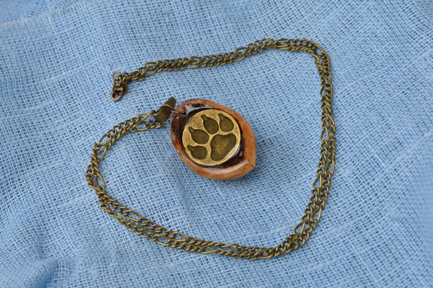 Handmade designer unusual pendant made of nut with wolf trace on chain photo 2