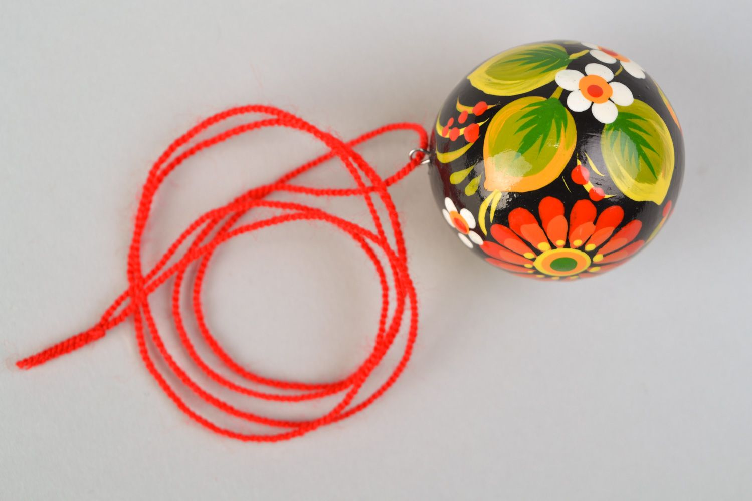 Handmade round wooden pendant with Petrikivka painting in Ukrainian style on cord photo 5