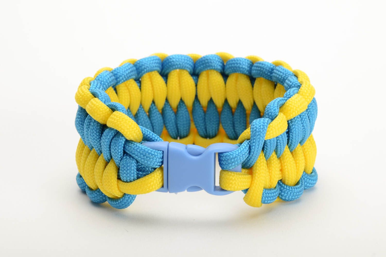 Handmade woven friendship bracelet made of paracord yellow with blue beautiful stylish accessory photo 3