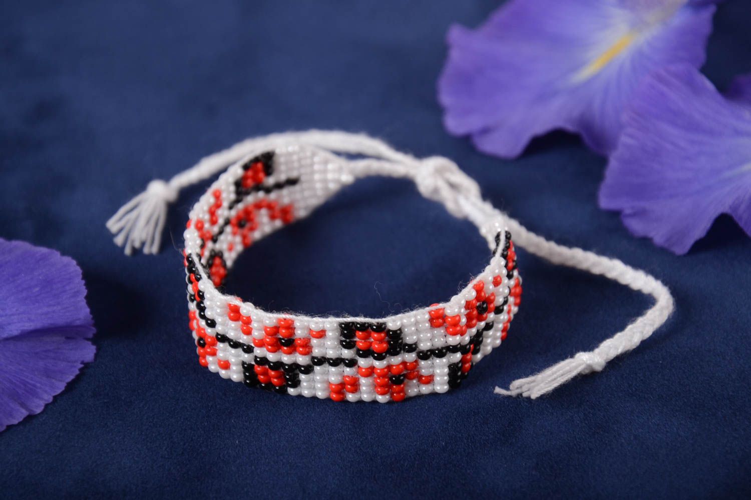 Handmade knitted beaded strand bracelet with Ukrainian ornament in red, black, and white color photo 1