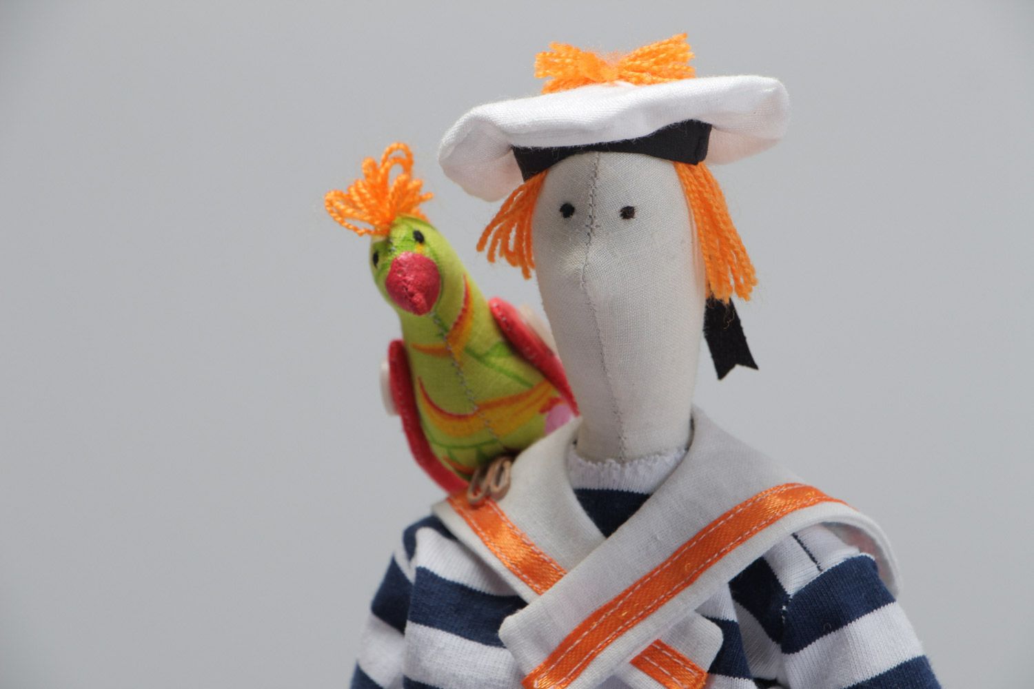 Handmade soft toy made of natural materials sailor with parrot photo 3