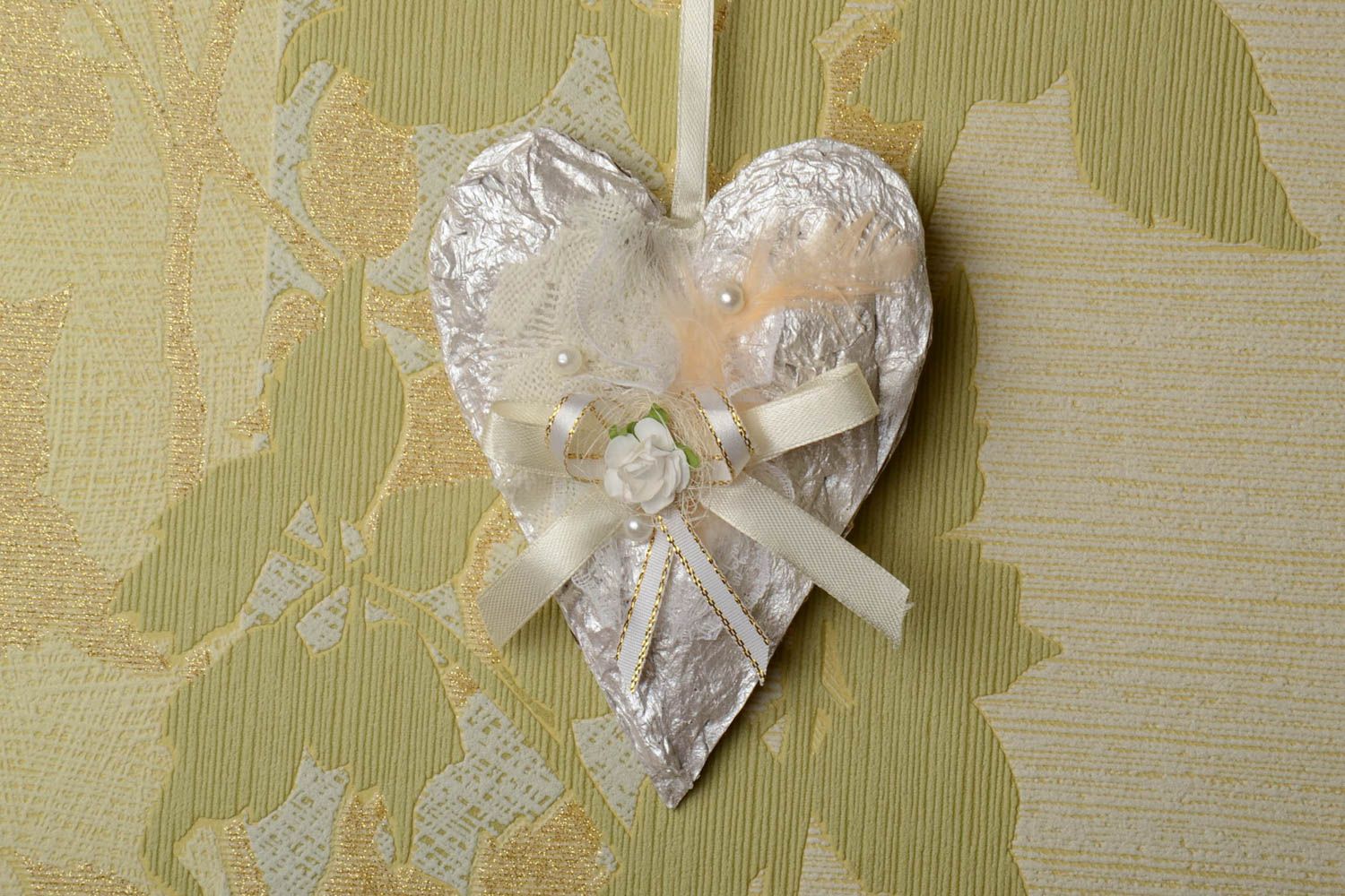 Handmade white heart-shaped carton wall hanging decorated with ribbons  photo 1
