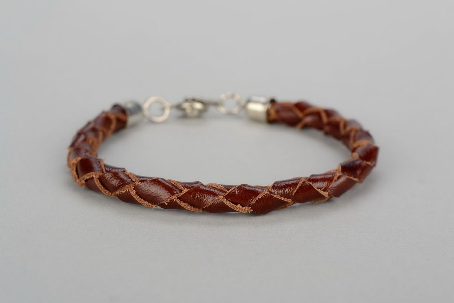 Round braided bracelet of brown color photo 4