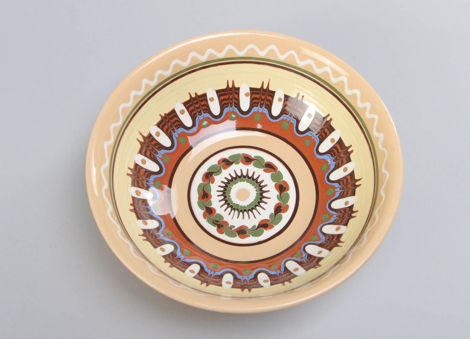 Homemade decorative ceramic bowl painted with glaze in ethnic style for 600 ml photo 3