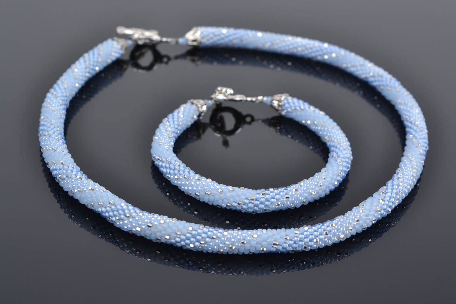 Handmade beaded cord and bracelet in blue color with metal fittings photo 1