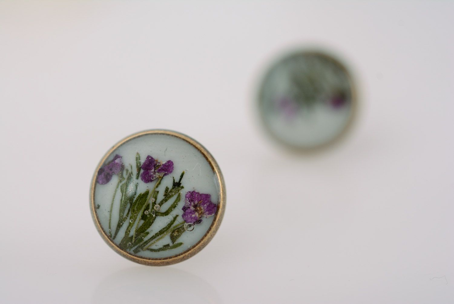 Handmade round stud earrings with tender floral composition in epoxy resin photo 5