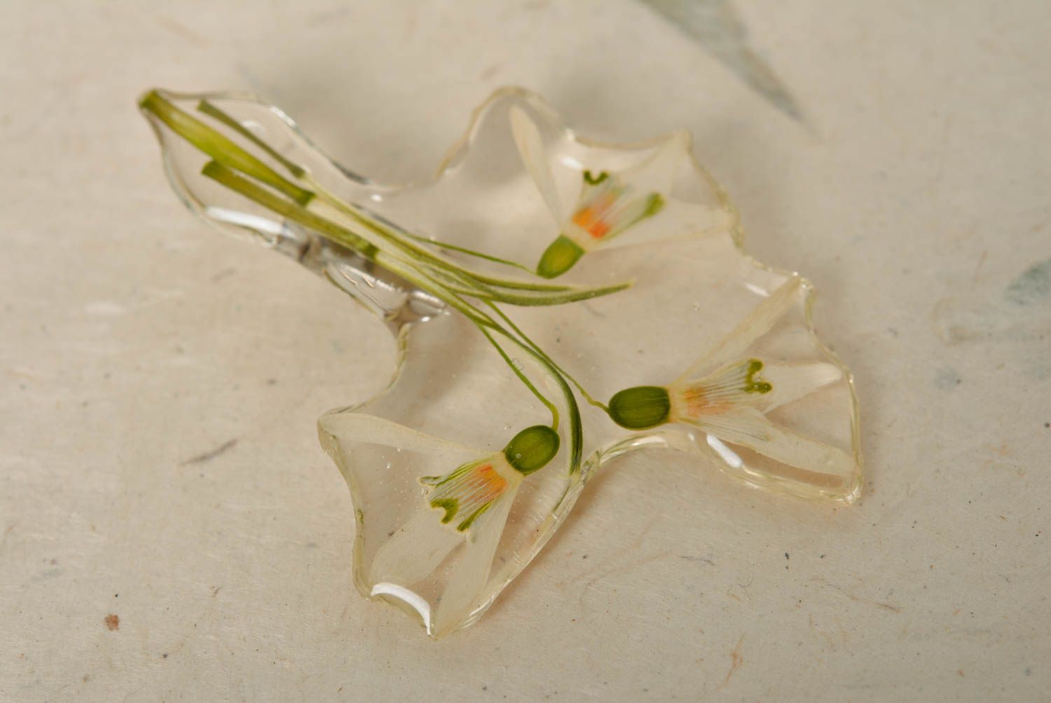 Beautiful transparent handmade brooch with dried flower and epoxy coating photo 1
