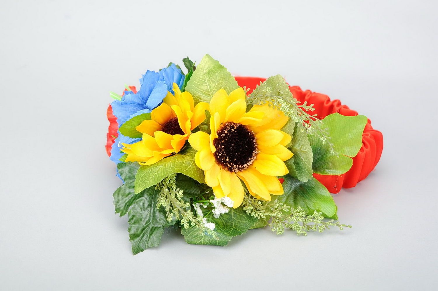 Wreath with artificial flowers on elastic band photo 1
