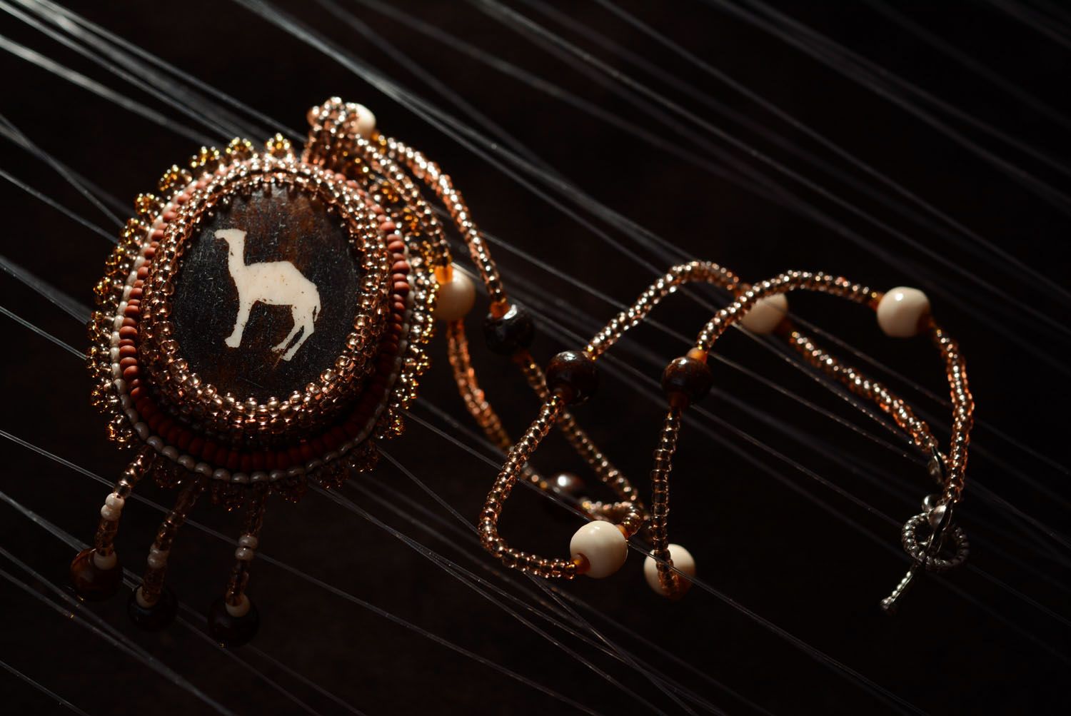 Beaded pendant with camel bone photo 1