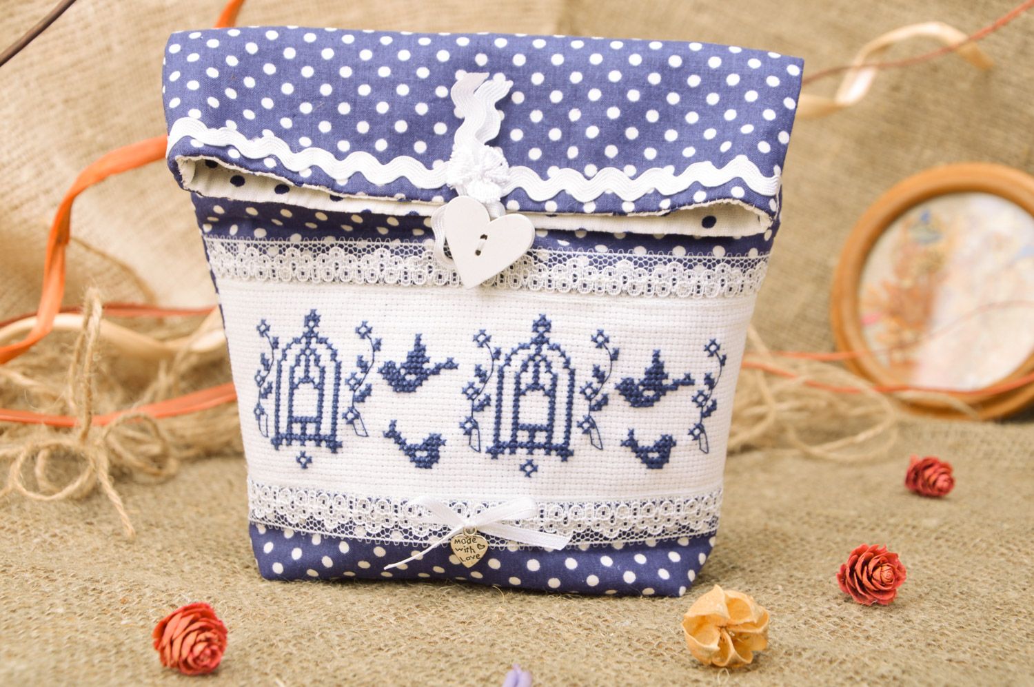 Cute handmade cosmetics bag sewn of blue polka dot cotton fabric with embroidery photo 1