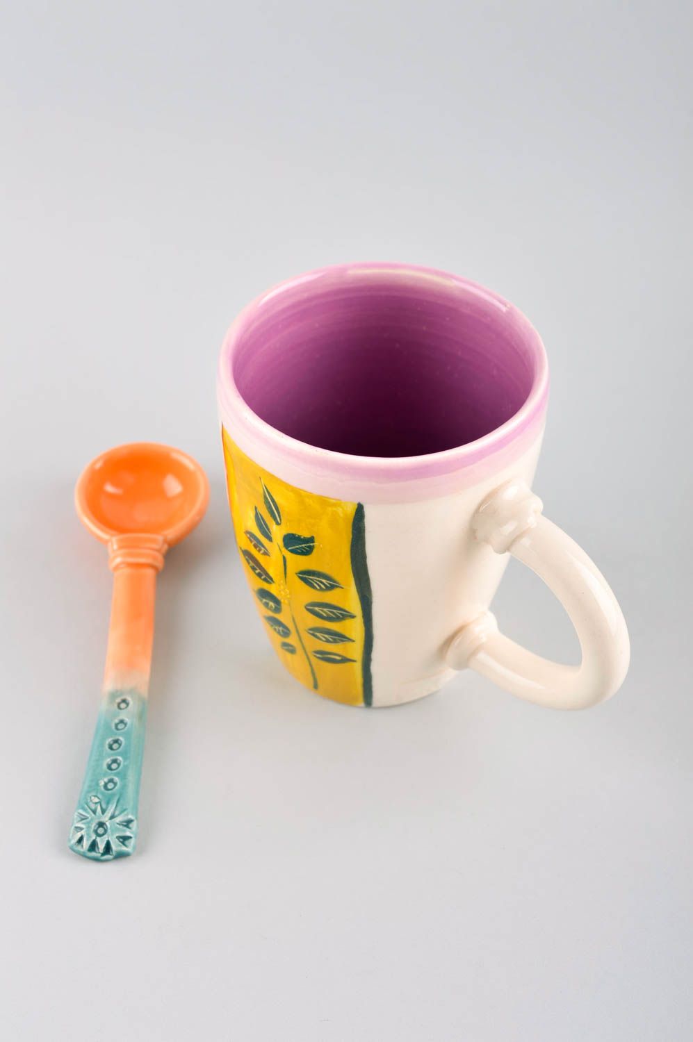 Glazed ceramic kids' drinking cup with ceramic spoon and bright pattern photo 3