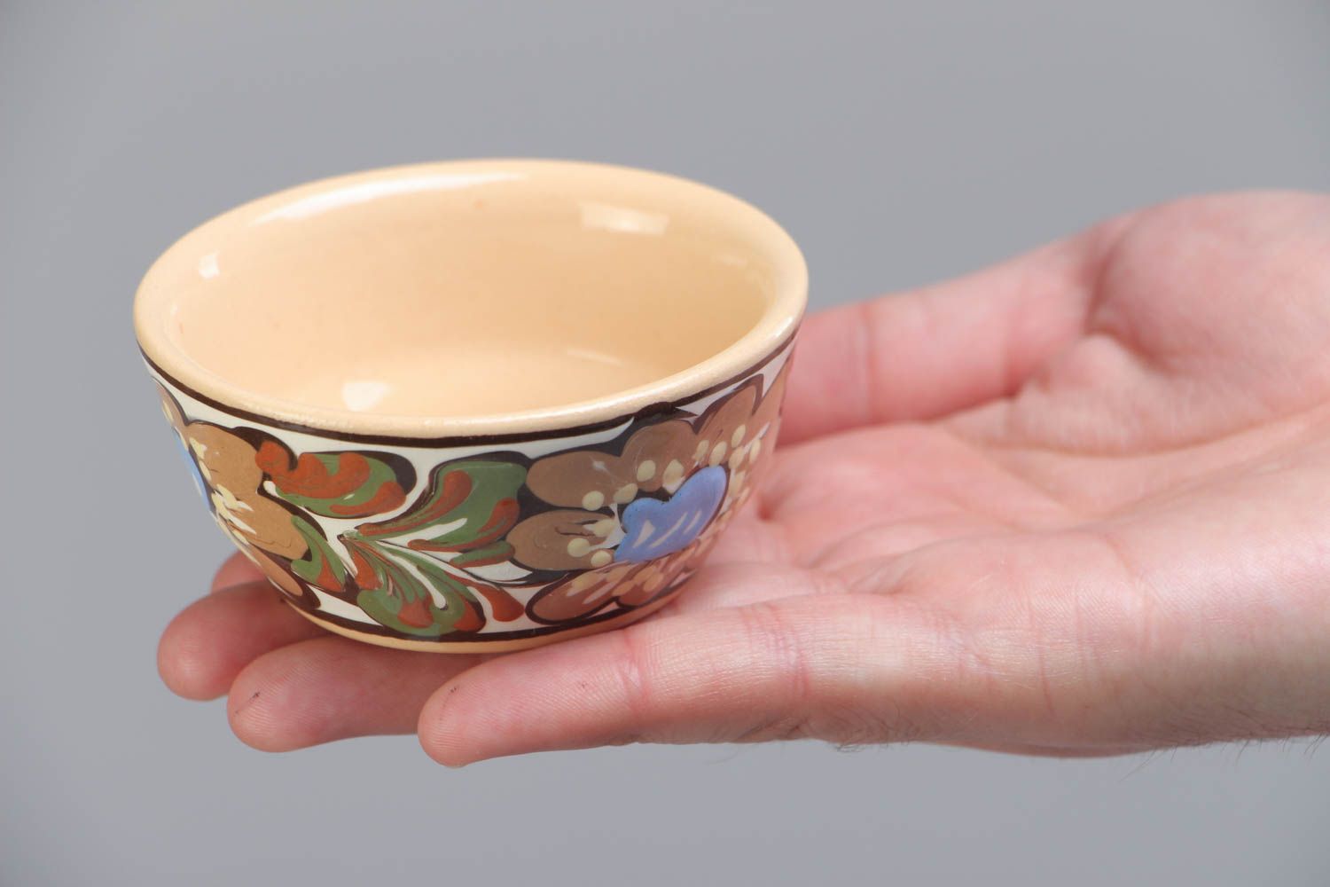 Handmade decorative small ceramic bowl ornamented with colorful glaze for sauces photo 5
