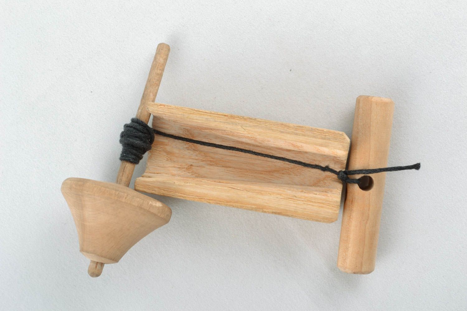 Wooden spin top for children photo 2