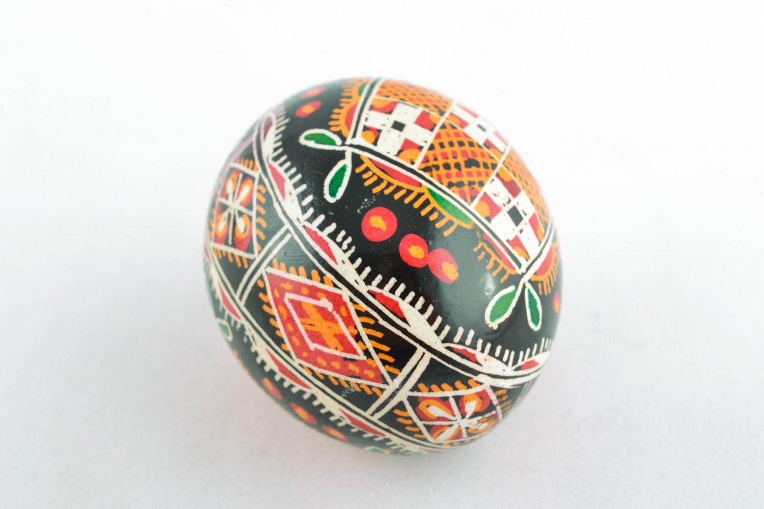 Homemade ornamented Easter egg pysanka with traditional painting made with hot wax photo 4