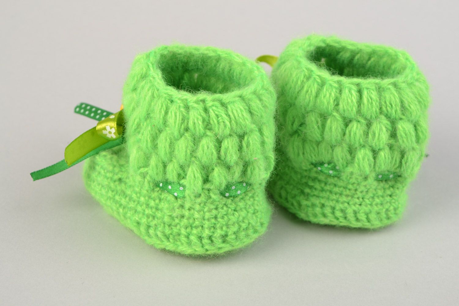 Handmade beautiful little crocheted booties for a baby girl with green bows  photo 5