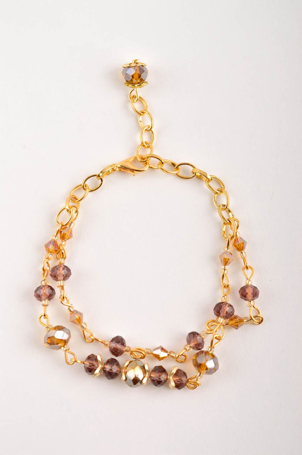 Chain bracelet in golden color with brown beads for girls photo 2