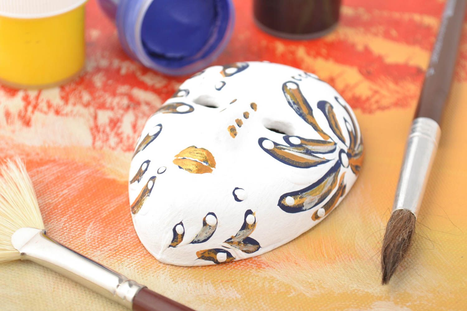 Handmade white painted wall pendant carnival mask made of clay photo 1