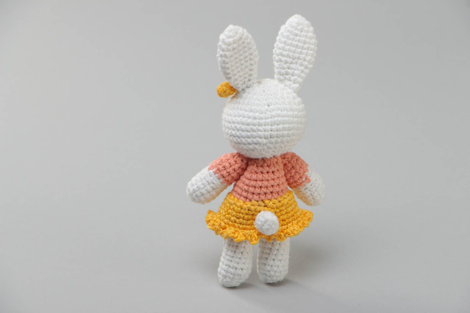 Handmade soft knitted white girl-rabbit toy in a dress for children photo 4