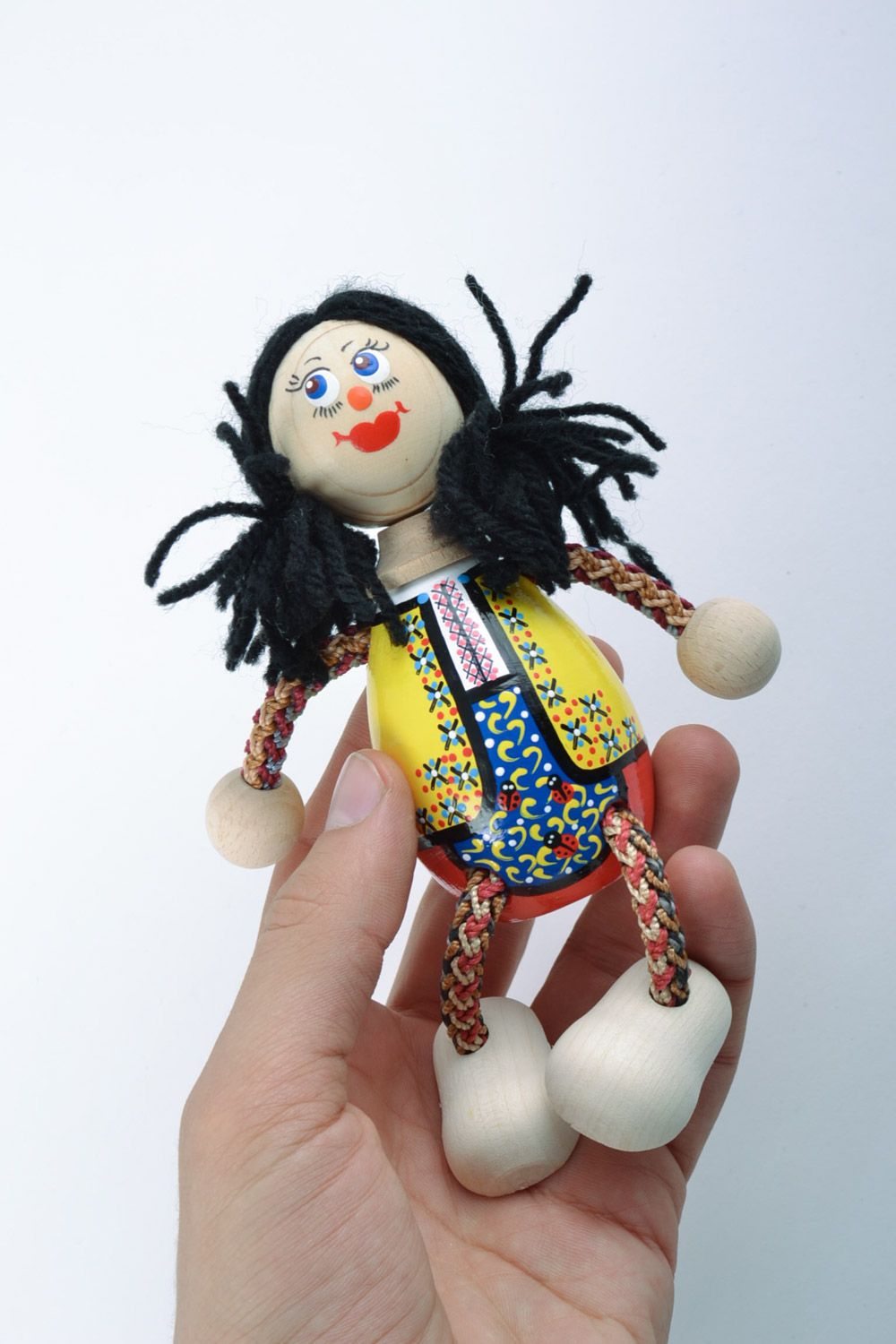 Juguete de madera muñeca de piernas de hilos infantil o para decorar artesanal foto 2