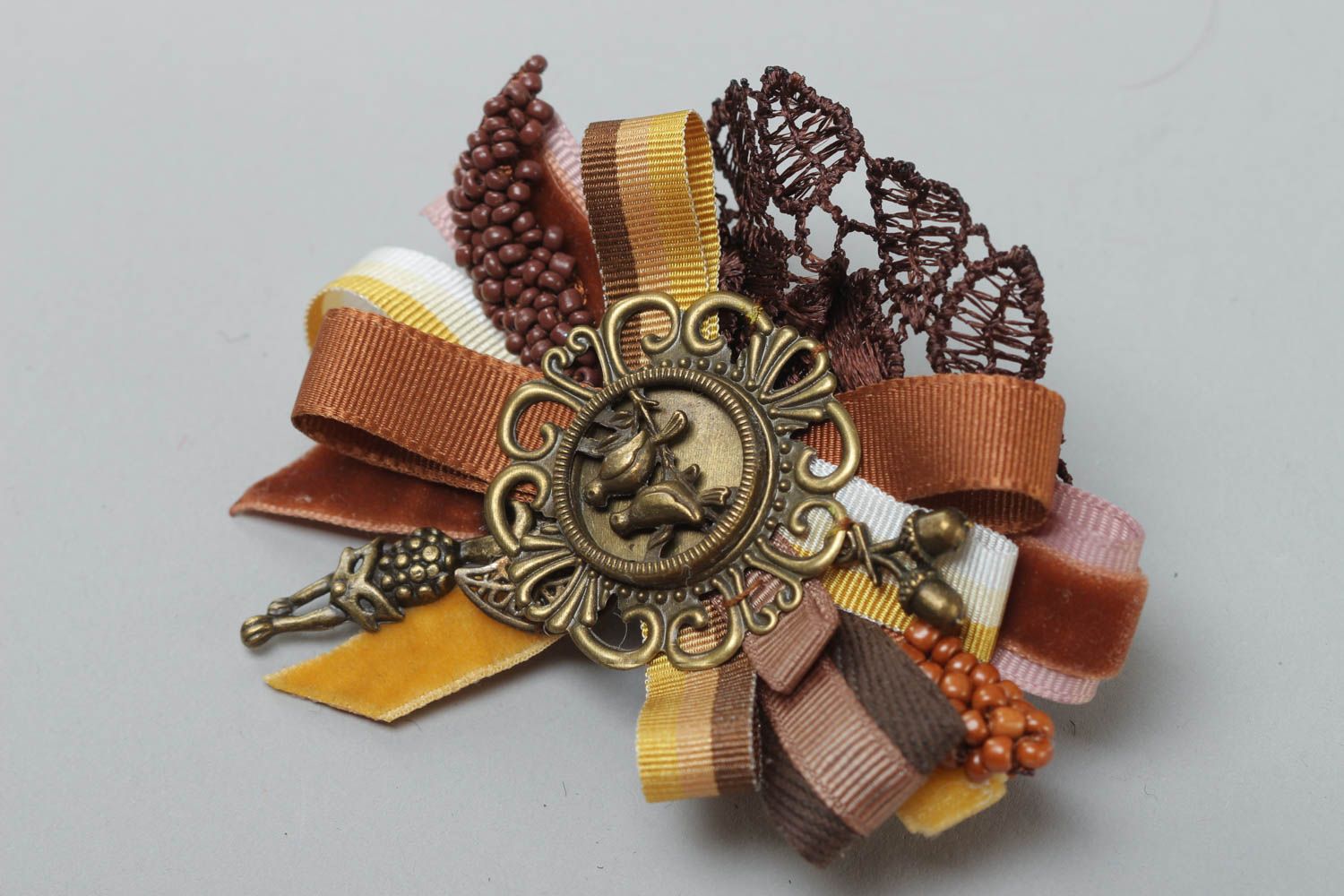 Handmade rep ribbon brooch with lace and charms in brown color palette photo 2