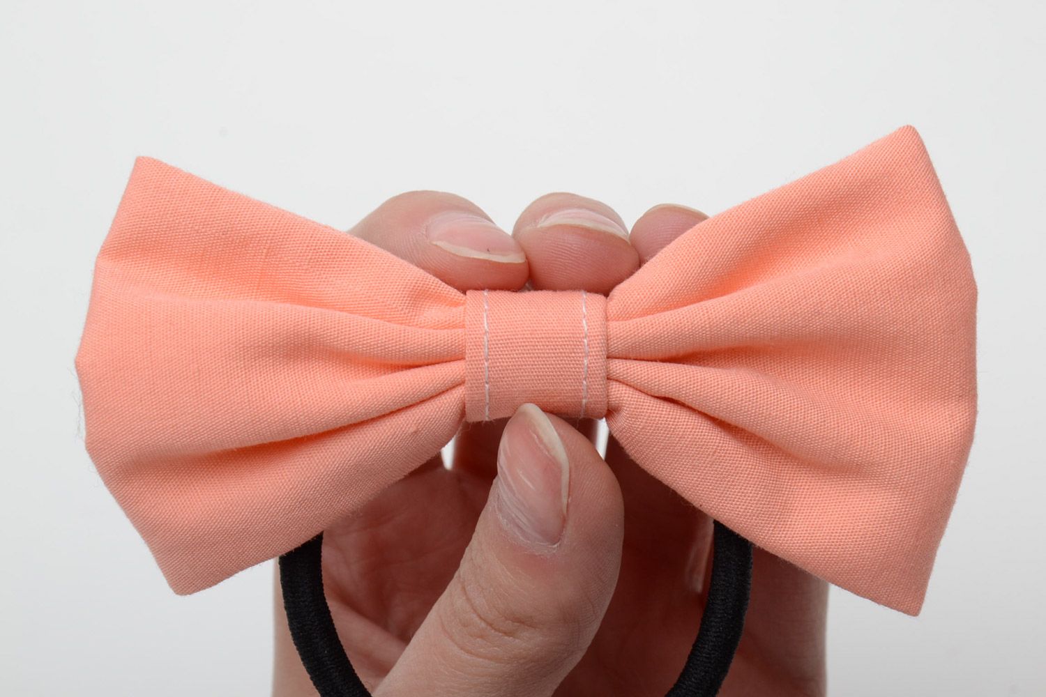 Handmade small women's cotton fabric bow hair tie of peach color photo 5