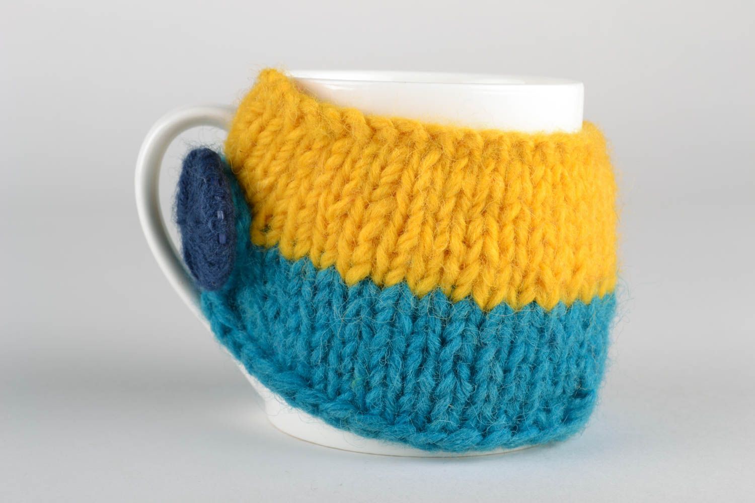 Glass cup in knitted sweater photo 2
